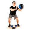 Challenging balance board for athletes, balancing while using a medicine ball