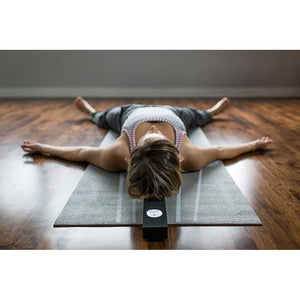 savasana with prop, yoga prop to open chest, chest opening savasana, the beam for chest opening